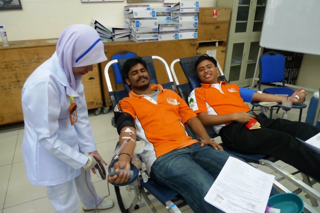 TOC students Darshan Ragunathan and Ikhwan Zulkifli doing their part at the recent blood donation drive.