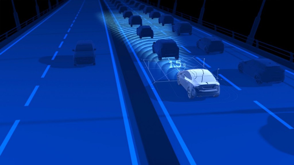 Queue Assist follows the vehicle ahead in slow-moving queues. It makes driving safer and more relaxed in monotonous stop-and-go traffic by steering assistance to the speed adaption. Acceleration, braking and steering are controlled automatically. This image is with a generic car, not the all-new XC90.